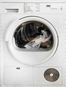 Técnico realizando la reparación de una lavadora en un domicilio de Madrid